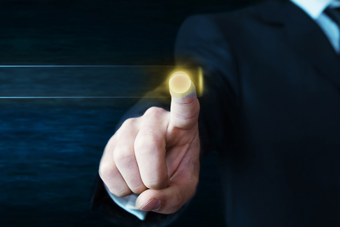 Why Your Website Is Losing Visitors — and How To Fix It Fast; A person in a suit touches a glowing virtual button with their index finger, set against a dark background. The image conveys a sense of technology and innovation.